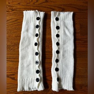 White leg warmers with buttons. Never worn. Great condition.
